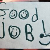 A hand drawn sign saying Good job and a smiley face