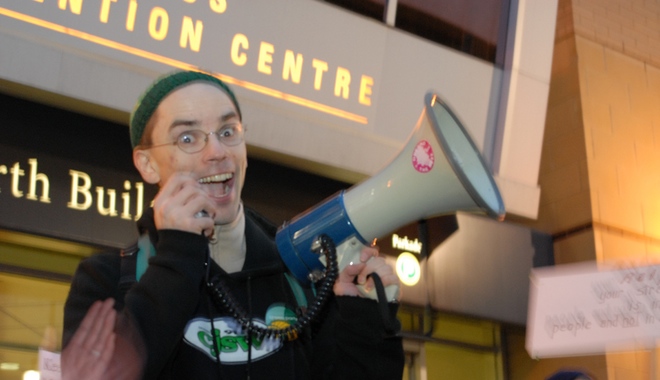 Smiling man, with megaphone